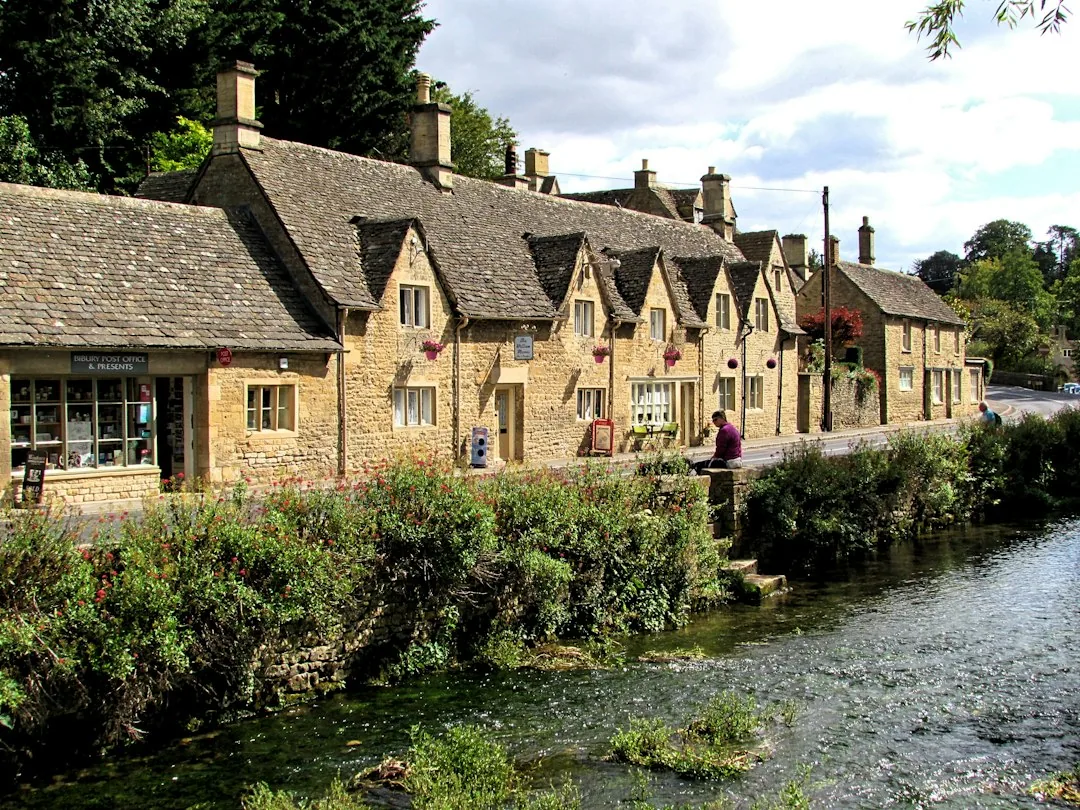Sherborne — brown concrete houses beside river