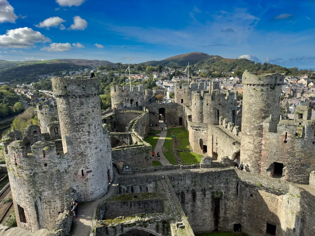 Conwy — an aerial view of a castle in the middle of a town