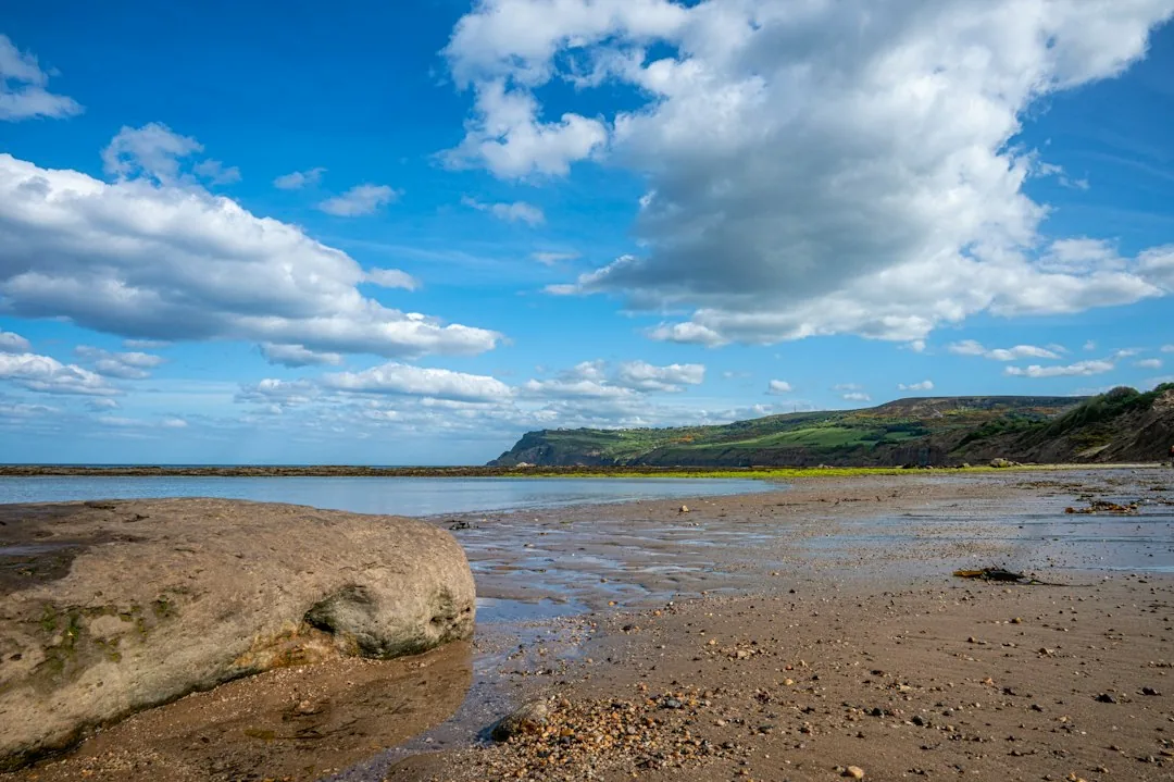 Robin Hood's Bay — a beach with rocks and water