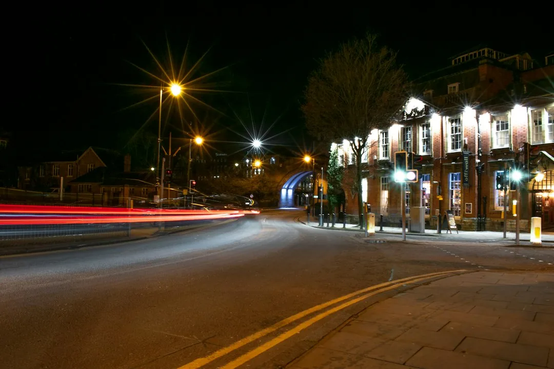Chester — time lapse photography of cars on road during night time